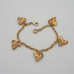 Carica l'immagine nel visualizzatore di Gallery, Bracciale Mille Baci CACAO Jewels in ottone placcato in oro 18 carati con cuori stropicciati.
