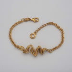 Carica l'immagine nel visualizzatore di Gallery, Bracciale Zig Zag CACAO Jewels in ottone placcato in oro 18 carati.
