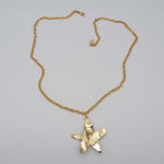 Carica l'immagine nel visualizzatore di Gallery, Collana Cielo CACAO Jewels in ottone placcato in oro 18 carati con pendente a stella.
