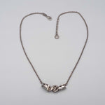 Carica l'immagine nel visualizzatore di Gallery, Collana Nastro CACAO Jewels in ottone placcato palladio.
