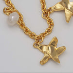 Carica l'immagine nel visualizzatore di Gallery, Dettaglio delle stelle modellate a mano e della labradorite naturale della Collana Costellazione CACAO Jewels.
